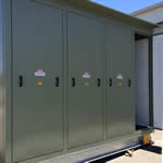 Kiosk substation (green) designed by Teck Global, outside with doors closed