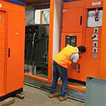Another engineer testing and commissioning a kiosk substation